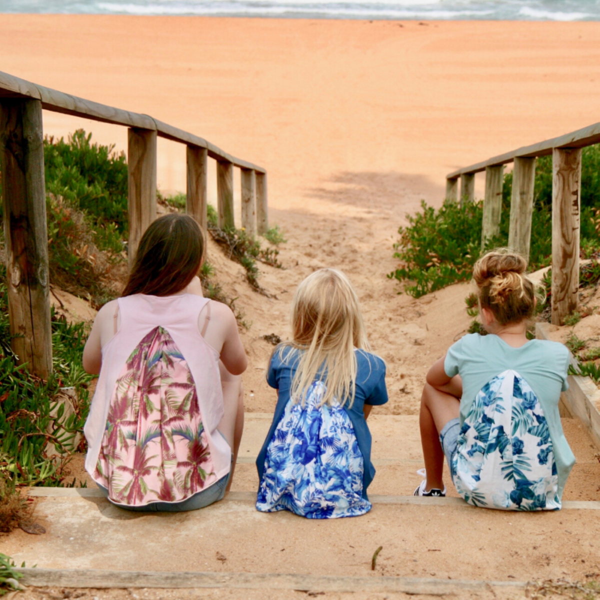 teen girls clothing short sleeve t-shirt top tropical prints by Love Haidee Australia back girls sitting on beach