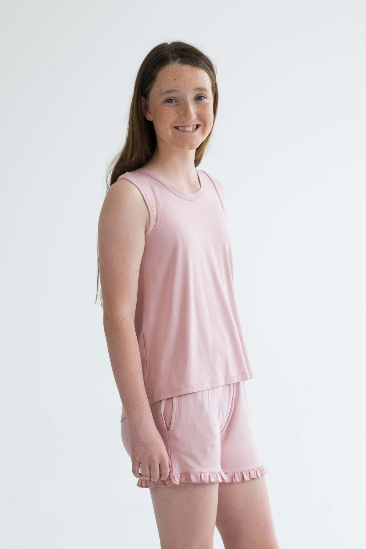 pink teen girls summer pyjamas set shorts with pockets and frill and singlet by Love Haidee Australia side view Ella 
